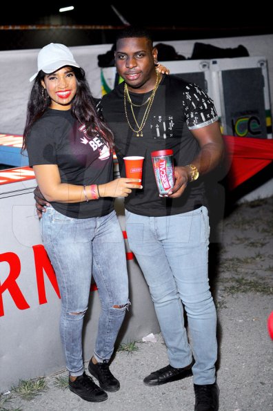 Anthony Minott/ Freelance PhotographerEllisse Campbell (left), assistant brand manager, Spirits, at Red Stripe and Adrian Williams, promoter of Smirnoff 90's Recall. *** Local Caption *** Anthony Minott/ Freelance PhotographerEllisse Campbell (left), assistant brand manager, Spirits, at Red Stripe and Adrian Williams, promoter of Smirnoff 90's Recall.