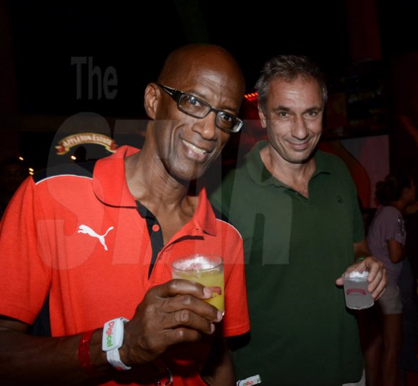 Winston Sill/Freelance Photographer
Bacchanal Jamaica final Friday Fete featuring Destra Garcia, held at Mas Camp, Stadium North on Friday night April 11, 2014. Here are Clement Lawrence (left), Managing Director, J Wary and Nephew;  and Stefano Saccardi (right), General Counsel and Business Development Officer, Gruppo Campari, inside the Forbidden Estate VIP Lounge.