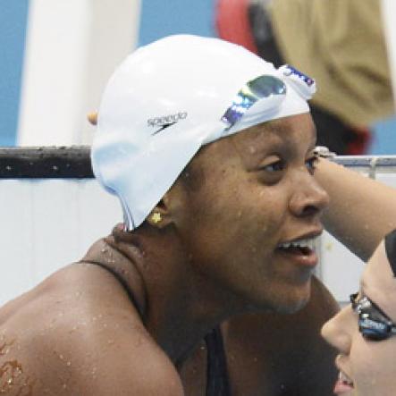 Ricardo Makyn/Staff Photographer
Alia (left) is being congratulated by Canadian
Tera Van Beilen at the Aquatic Centre Olympic Park in the Semifinal