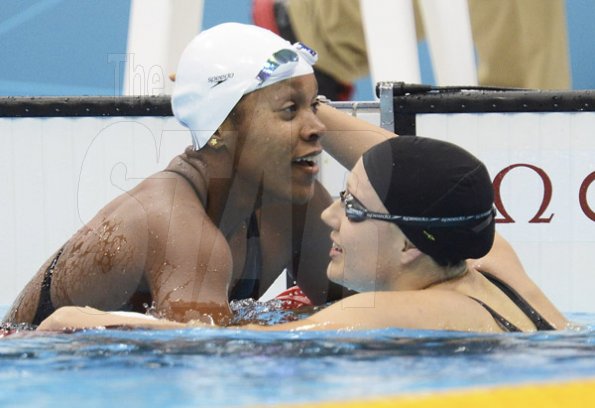 Ricardo Makyn/Staff Photographer
Alia (left) is being congratulated by Canadian
Tera Van Beilen at the Aquatic Centre Olympic Park in the Semifinal