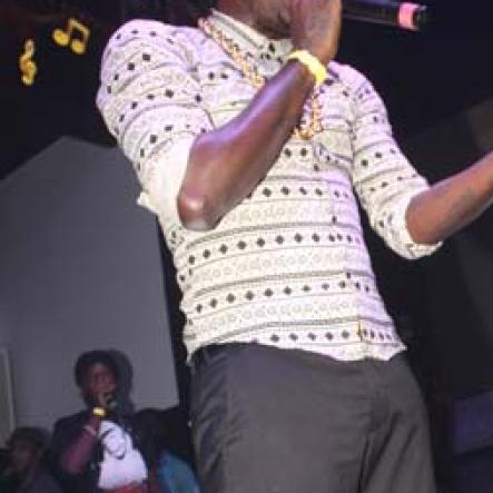 Anthony Minott/Freelance Photographer
Aidonia speaks to his fans during his performance during Aidonia in concert at Famous Night Club last Sunday.