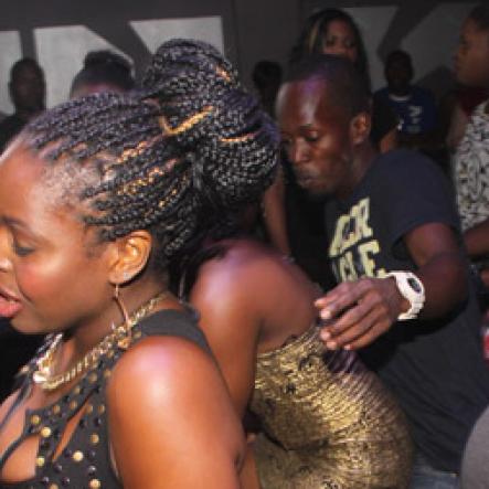 Anthony Minott/Freelance Photographer
Ladies bruck out during Aidonia in concert at Famous Night Club last Sunday.