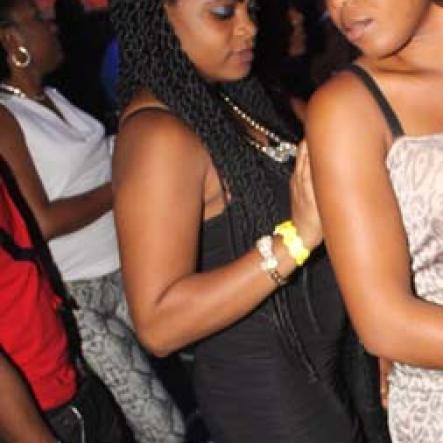 Anthony Minott/Freelance Photographer
Two beauties are spotted on the dance floor during Aidonia in concert at Famous Night Club last Sunday.