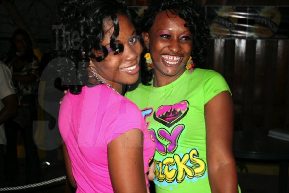 Roxroy McLean Photo

These two females were all smiles while selectors Boom Boom and Foota Hype provided the music, at the weekly Alliance Happy Thursday dance, held at Kno Limits Sports Bar, in St Andrew.