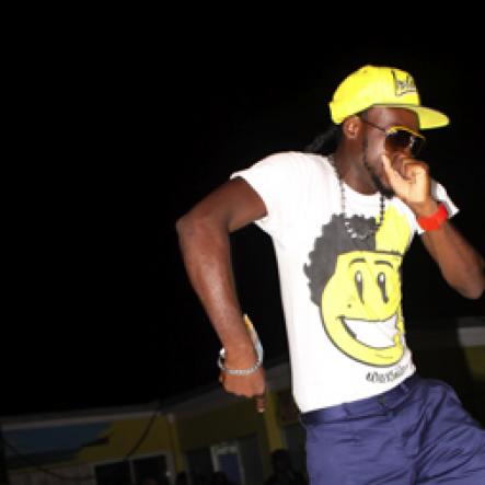 Anthony Minott/Freelance Photographer
A dancer imitates Bounty Killer on stage during Jamaica 50 Edition of An'so Thursdays atop the roof of Cookie's Night Club, Port Henderson Road, Portmore, St Catherine on Thursday, August 2, 2012.