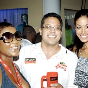 Winston Sill / Freelance Photographer
Alex Chin seems very content between two lovely ladies; queen of the dancehall, Marian "Lady Saw" Hall (left) and former Miss Jamaica World,  Yendi Phillipps at the Appleton ATI Launch Party.


 held at Carlos Cafe, New Kingston on Wednesday, July 1.