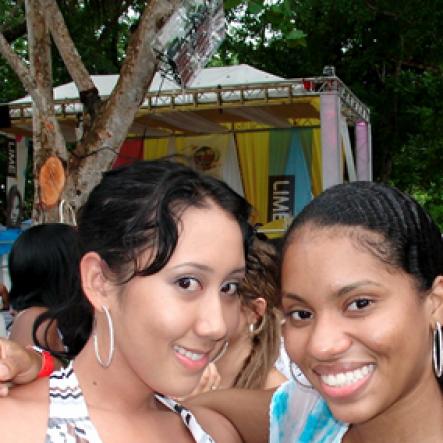 Kellie Chen (left) and Ashley Hastings-Robinson are  spotted for a close-up at Smirnoff Daydreams, part of the Smirnoff Dream weekend on Saturday July 30, at Long Bay Beach, Negril.