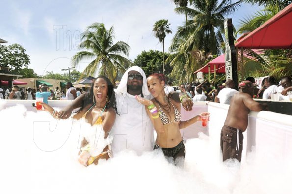 Seena Gayle

This man was happy to be sandwiched by two women while enjoying himself in the foam.