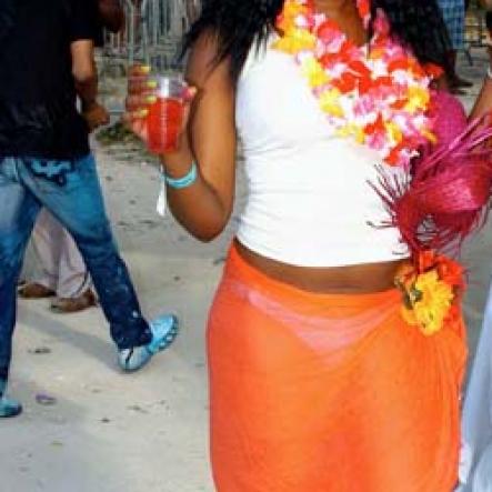 Winston Sill / Freelance Photographer
                                                                                The look on her face suggest that there was something puzzling going on.                                                                                                                                                                                                                                                                                                                                                                                                                                                                                                                            at Bacchanal Jamaica's Beach Jouvert, held at James Bond Beach, Orocabessa, St Mary on Saturday April 3, 2010.