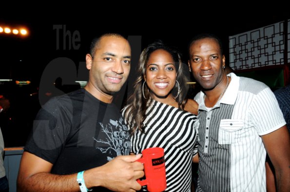 Winston Sill / Freelance Photographer
David Walton (left), of J. Wray and Nephew; Chantal  Raymond,  Miss Jamaica World and Shurwayne Winchester are spotted inside the Appleton Skybox at Bacchanal Jamaica fete with Pure Country and Applrton playing hosts, at Mas Camp, Oxford Road, New Kingston on Friday night.

*************************************************************************** April 1, 2011. Here are David Walton (left), of J. Wray and Nephew; Chantal  Raymopnd (centre). Miss Jamaica World; and Shurwayne Winchester (right)  inside the Appleton Skybox.