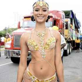 Patrick Planter/ Photographer<\n>Miss Universe Jamaica 2014 Kaci Fennell shimmers in gold, making the road march her very own runway for Bacchanal Carnival 2017.<\n>Bacchanal Jamaica Road March on Sunday April 23, 2017 at 9:00am