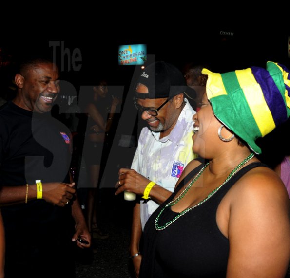 Winston Sill / Freelance Photographer
Bacchanal Jamaica and Appleton Jamaica Rum J'ouvert  and Road Parade under the theme "Alien Invasion", featuring Destra Garcia, held at The New Mas Camp, Stadium North on Friday night until daylight April 13, 2012.. Here are Phillip Paulwell (left); ----??? Bell (centre); and Lisa?? Bell (right).
