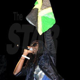 Winston Sill / Freelance Photographer
St Vincent artiste Skinny Fabulous waves a Jamaican flag during his performance at the Bacchanal Jamaica Carnival Fete held at Mas Camp, Oxford Road, New Kingston on Friday night.