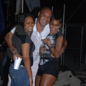 Janet Silvera Photo
 
Barefoot party promoter, Junior 'Flette' Barnes (left), hugs his sister-in-law, Isiaa Madden (right) and her niece, Aneika Madden at the Barefoot party at Tropical Beach in Montego Bay last Sunday night.
