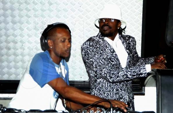 Winston Sill / Freelance Photographer
                                                                                    Beenie Man makes a grand entrance at his birthday bash, while selecter Supa Hype maintains the musical vibe on the turntables.                                                                                                                                                                                                                                                                                                                           August 21, 2010.