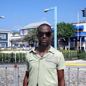 Nicolas Wallace, the designated Montego Bay winner of the 9.58 Town Centre Ticket Giveaway for track superstar Usain Bolt's 9.58 Super Party, poses for The Gleaner in Sam Sharpe Square on Thursday.