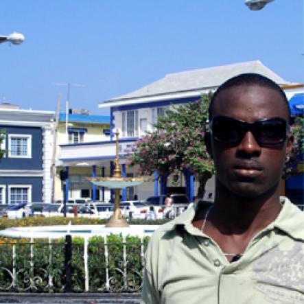 Nicolas Wallace, the designated Montego Bay winner of the 9.58 Town Centre Ticket Giveaway for track superstar Usain Bolt's 9.58 Super Party, poses for The Gleaner in Sam Sharpe Square on Thursday.