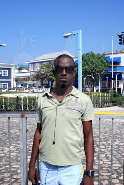 Nicolas Wallace, the designated Montego Bay winner of the 9.58 Town Centre Ticket Giveaway for track superstar Usain Bolt's 9.58 Super Party, poses for The Gleaner in Sam Sharpe Square on Thursday.