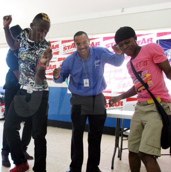 Roxroy McLean
Deputy Managing Director of The Gleaner Company Christopher Barnes (centre) joins Roddy Rich (left) and the White Out crew on the dance flooor.