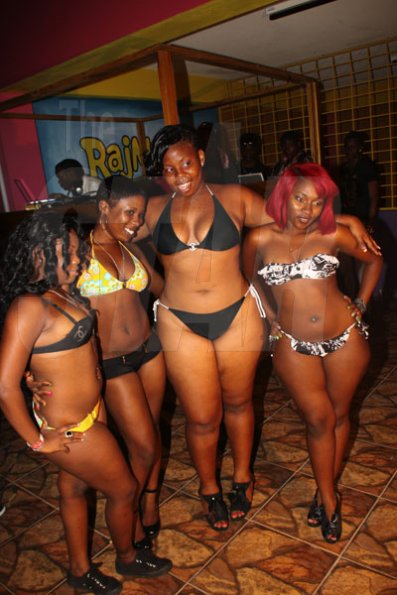 Anthony Minott/Freelance Photographer
Winner, Yanique Frazer, (right), with fluffy, Allison Bennett (second right), Trudy, (second left), and another contestant pose for the camera during the Miss Best Booty competition during Booty Fridays at the Sky Terrace Rajmaville Mall, Hellshire Main Road, on Friday, June 8, 2012.