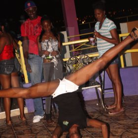 Anthony Minott/Freelance Photographer 
A Rajmaville vixen created a stir with her "head top" routine during Booty Fridays at the Sky Terrace Rajmaville Mall, Hellshire Main Road, on Friday, June 8, 2012.
