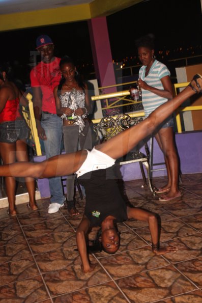 Anthony Minott/Freelance Photographer 
A Rajmaville vixen created a stir with her "head top" routine during Booty Fridays at the Sky Terrace Rajmaville Mall, Hellshire Main Road, on Friday, June 8, 2012.