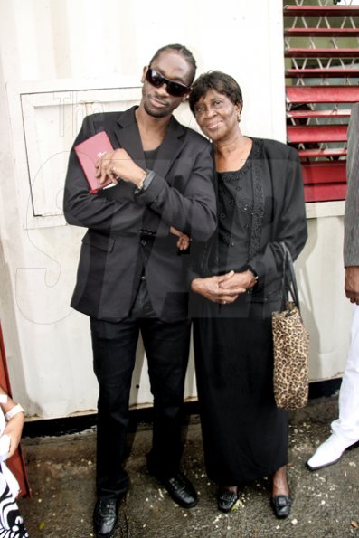 Anthony Minott/Freelance Photographer
                                                                                         Bounty Killer (left) and his mother Ivy 'Mama Ivy' Williams, after a church service at the Agape Christian Fellowship church on Sunday, April 18, 2010.