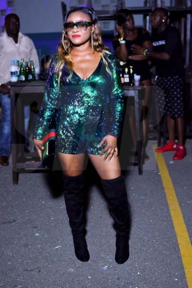 Anthony Minott/freelance photographerTanya glitters in green at Bounty Killer's birthday party held on Saturday at the waterfront, downtown Kingston.