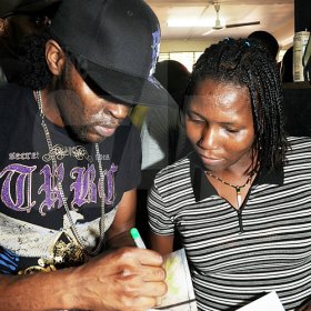 Ian Allen/Photographer
Bugle signs an autograph for a member of the audience.