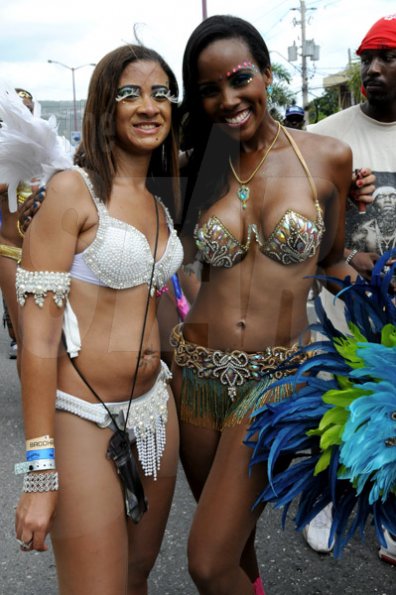 Winston Sill / Freelance Photographer
Bacchanal Jamaica Carnival Road Parade, on the streets of Kingston, held on Sunday April 7, 2013. Here is Sara Lawrence (right) and a friend.