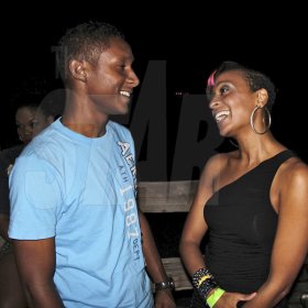 - Contributed

Red Stripe's Jermaine Young chats with entertainer Alaine just prior to her performance at Talawah Caution on Saturday Sept 15th at the Wickie Wackie Beach, St Thomas.