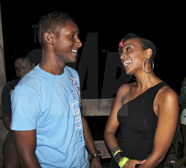 - Contributed

Red Stripe's Jermaine Young chats with entertainer Alaine just prior to her performance at Talawah Caution on Saturday Sept 15th at the Wickie Wackie Beach, St Thomas.