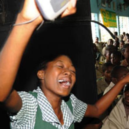 Ricardo Makyn/Staff Photographer.
She was clearly having a good time at The Gleaner 100 Champs Tour held at St. Jago on Friday, February 26, 2010.