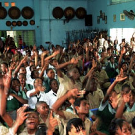 Ricardo Makyn/Staff Photographer.
Jubilant St Jago students react positively to a presenter during the Gleaner Champs 100 tour at the school yesterday.