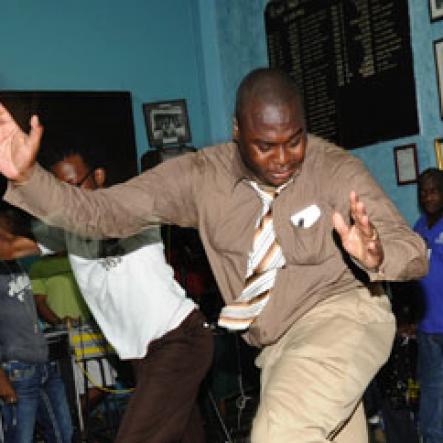 Ricardo Makyn/Staff Photographer.
St. Jago High School's teacher Marlon Henry, shows off his dancing skills during a teacher's dancing contest at The Gleaner 100 Champs Tour held at the school on Friday, February 26, 2010.