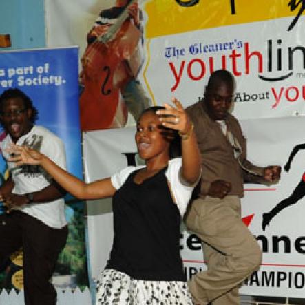 Ricardo Makyn/Staff Photographer.
(From left): Teachers: Andrae Simpson, Naudia Walker and Marlon Henry showcased their best dance moves during a teacher's dance contest at The Gleaner 100 Champs Tour held St. Jago on Friday, February 26, 2010.