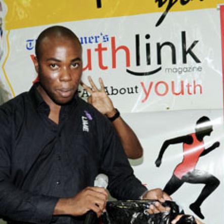 Ricardo Makyn/Staff Photographer.
LIME represenative Nathaniel Palmer (Left) presents Mrs. Naudia Walker, winner of the teacher's dancing contest with a gift bag from LIME at The Gleaner 100 Champs Tour held at St Jago High yesterday.

 on Friday, February 26, 2010.