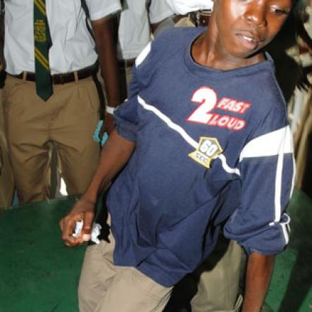 Ricardo Makyn/Staff Photographer.
First form student Leon Ratter danced much to the delight of his school mates at The Gleaner Champs 100 Tour held at St.Jago High on Friday, February 26, 2010.
