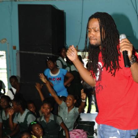 Ricardo Makyn/Staff Photographer.
Reggae artiste Duane Stephenson rocking to the music during his performance at The Gleaner Champs 100 Tour held at St. Jago High on Friday, February 26, 2010.
