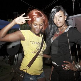 Anthony Minott/Freelance Photographer
Chicken Back Satdaze promoter, Kimone (left), and her friend take a photo opt during the monthly party, Chicken Back Satdaze at Keswick Avenue, Cumberland, Portmore, St Catherine on Saturday, April 28, 2012.