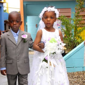 Anthony Minott/Freelance Photographer
Give-away father, Mrak-Twaine Davidson walks down the aisle with the bride, Moya Green during a role play of a wedding ceremony at the Bridgeport Infant school, in Portmore, St Catherine on Friday, November 13, 2009.