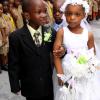 Anthony Minott/Freelance Photographer
The groom, Javier Foster (left), takes his bride Moya Green to the alter as the give away father, Mark-Twain Davidson (background), and children look on during a role play of a wedding ceremony at the Bridgeport Infant school, in Portmore, St Catherine on Friday, November 13, 2009.