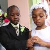 Anthony Minott/Freelance Photographer
The groom, Javier Foster (left), slips on the ring on the finger of his beautiful bride, Moya Green during a role play of a wedding ceremony at the Bridgeport Infant school, in Portmore, St Catherine on Friday, November 13, 2009.