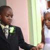 Anthony Minott/Freelance Photographer
Bride Moya Green (right), slips on the ring on groom Javier Foster during a role play of a wedding ceremony at the Bridgeport Infant school, in Portmore, St Catherine on Friday, November 13, 2009.