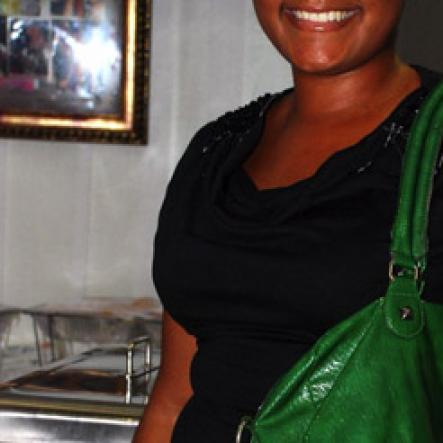 Colin Hamilton/PHOTOGRAPHER
Ayesha Dawes seems happy with her big green bag at 
Chino Album Launch at the Devonshire Hotel on Monday May 24, 2011.
