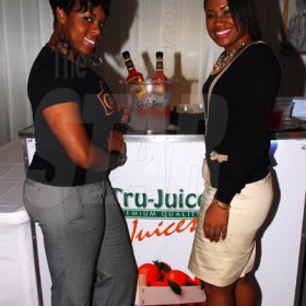 Colin Hamilton/PHOTOGRAPHER
From left, True Juice Brand Manager Tammi Ann Givans poses with Bars-To-Go boss Patrice McHugh at Chino Album Launch at the Devonshire Hotel on Monday May 24, 2011.