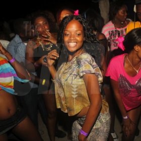 Anthony Minott/Freelance Photographer
Young people dance up a storm during RumBar Chug it Sugarman's Beach, Hellshire, Portmore, St Catherine, on Sunday, July 8, 2012