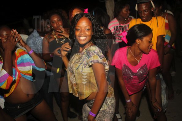 Anthony Minott/Freelance Photographer
Young people dance up a storm during RumBar Chug it Sugarman's Beach, Hellshire, Portmore, St Catherine, on Sunday, July 8, 2012