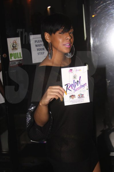 Anthony Minott/Freelance Photographer
Danielle, aka D.I. promotes her party Rebel Tuesday during Grandeur party held recently at Club Impulse, in New Kingston recently.