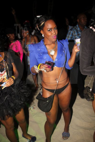 Anthony Minott/Freelance Photographer 
Nordia shows off a sexy pose as she enjoys the lime light during Container Beach Party at Waves Beach, Hellshire, Portmore St Catherine on Saturday, March 31, 2012.